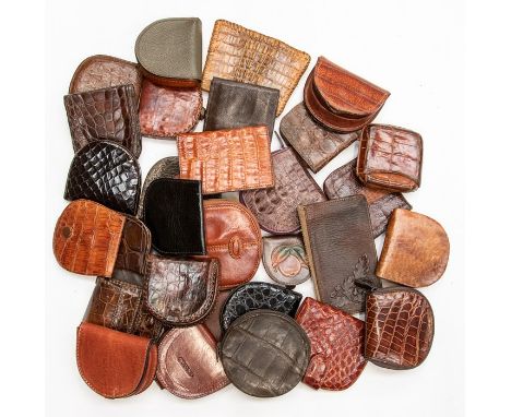 Thirty various recent and vintage leather and crocodile gentleman's coin holders. (30)Condition: some unused, others showing 