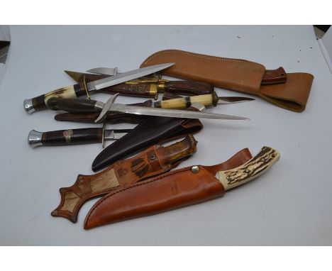 A group of various vintage and recent fixed blade knives, including a Mauser full tang with stag horn grips and 4.5" blade, a