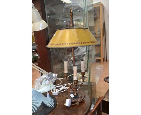 A base metal three branch table lamp with green adjustable toleware shade, 60cm high