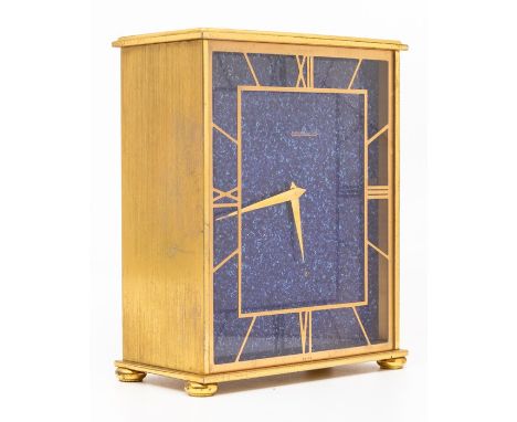 A Jaeger le Coultre mantel clock, mid-20th Century, the gilt brass case of rectangular outline, raised on four compressed bun