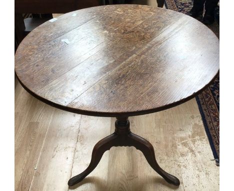 A George III large oak plank tilt top tripod table, a pair of George I elm side chairs and a George III revolving tazza (4)