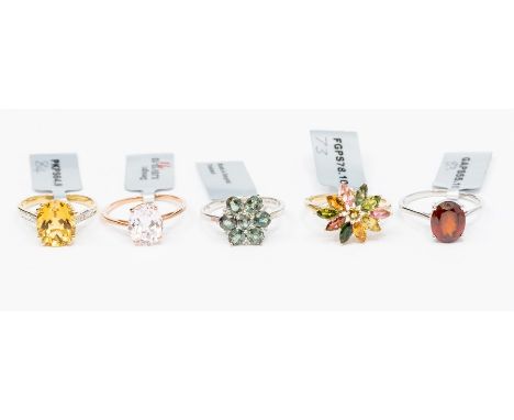 A collection of 9ct gold rings to include an oval kunzite and rose gold ring, a multicolour tourmaline cluster ring set win y