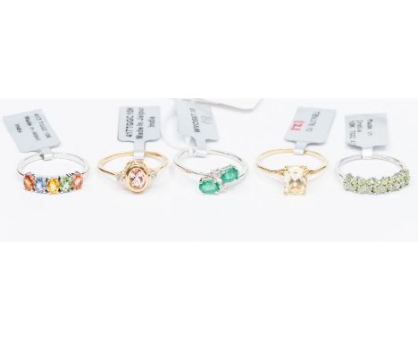 A collection of 10ct gold rings to include a white gold and green garnet double row half eternity ring, a morganite and zirco