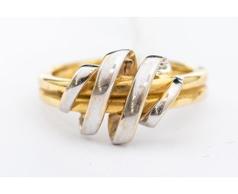 A 14ct gold two tone ring, the yellow band with overlaid white gold coil to the top, size Q, assessed as 14ct gold, total wei