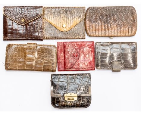 Seven various Edwardian and later vintage silver mounted and other crocodile and snakeskin ladies purses. (7)Condition: varyi