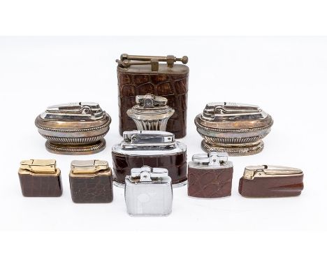 An assembled group of vintage cigarette lighters, including a Fujiama crocodile cased 'oversize' table lighter, three Ronson 