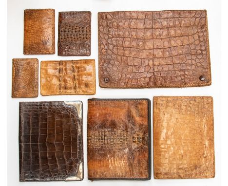 A group of Edwardian and later vintage crocodile accessories, including a silver mounted document wallet, three other documen