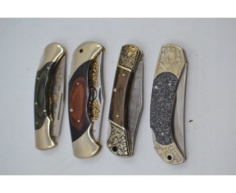 Four recent vintage Herbertz folding lock knives, three with wood handles and engraved 3.5" blades, the fourth with granite i