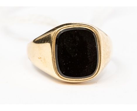 A 9ct gold and onyx signet ring, cushion shaped onyx approx. 11 x 9mm, size R½, total gross weight approx 4.6gmsCondition rep