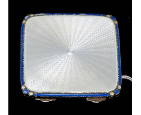 An Art Deco sky blue enamelled powder compact, blue enamelled edging, silver body, with engine turned back, Birmingham 1935, 