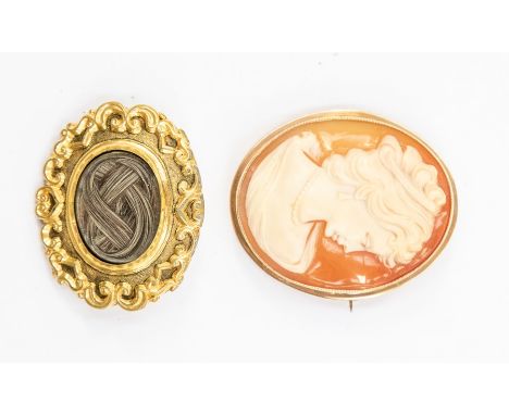 A 9ct gold mounted shell cameo brooch, depicting bust portrait of a lady, approx 12.6g, and a mourning brooch with glazed hai