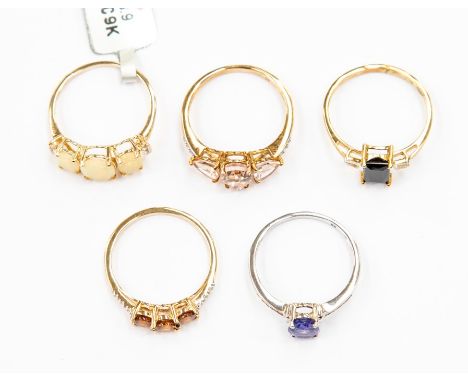 A collection of 9ct gold rings to include a rose gold, morganite and diamond three stone ring, an Ethiopian opal three stone 