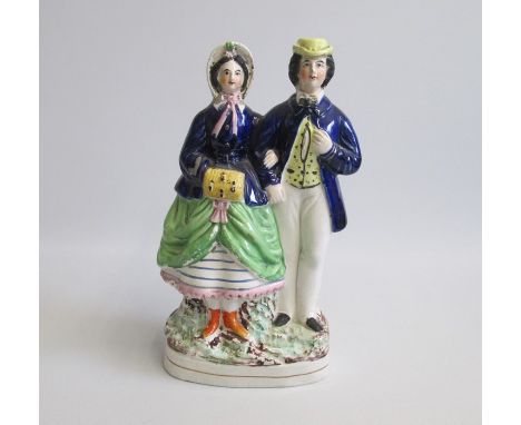 A Staffordshire Portrait figure of Princess Alice and Louis of Hesse standing on a gilt lined base See Harding Book 1 page 20