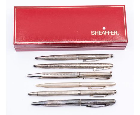 A silver ballpoint pen and retracting pencil set, Birmingham 1993, with engine-turned finish, together with another similar r