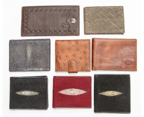 A group of six recent vintage exotic hide gentleman's wallets, including stingray and ostrich hide, together with two leather