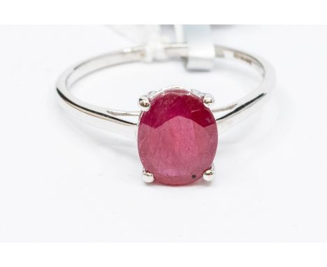 A ruby and 10ct white gold solitaire, claw set with an oval ruby approx. 3.5carats, possibly of Madagascan origin, size T1/2,