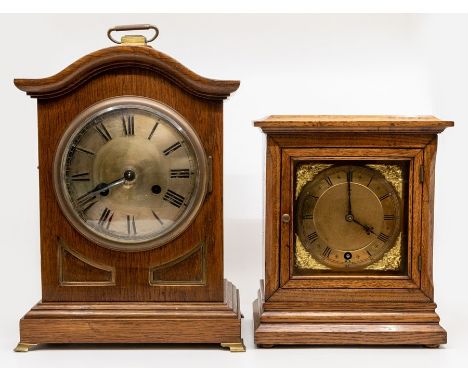 A German oak bracket clock, early 20th Century, with arched top and plinth base, the silvered 5.5" dial having black Roman nu