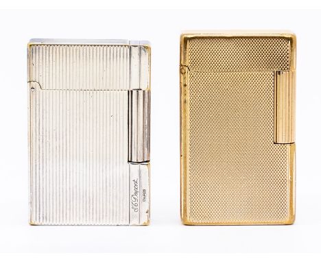 Two St.Dupont Paris cigarette lighters, 3rd quarter 20th Century, one yellow metal, the other silver plated, each with engine