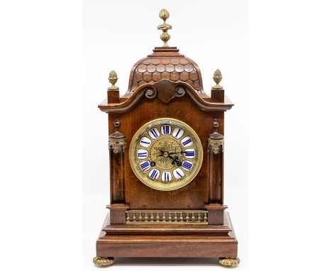A French mahogany bracket type mantel clock, circa 1900, of gothic influence architectural form with brass finials and other 