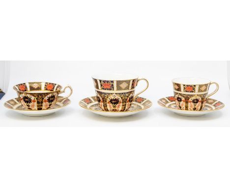 Seven Royal Crown Derby teacups and saucers, coffee can with saucer all in the 1128 designCR second quality, no chips or crac
