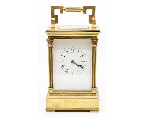 A French gilt brass carriage clock, the five-glass case with corner Corinthian pilasters and bracket handle, the white enamel