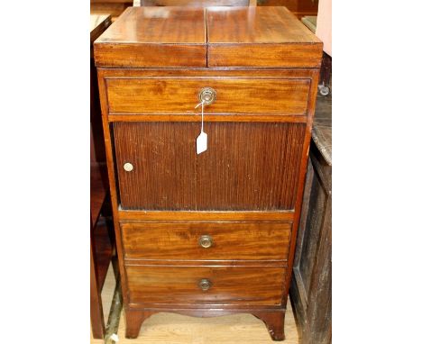 A George III mahogany night stand, having a double folding top, tambour front, with drawer below, raised on bracket feet, 86c