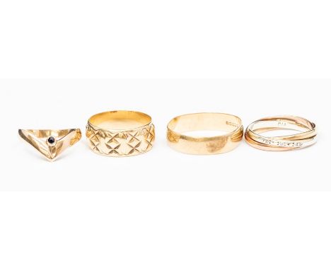 Four 9ct gold rings to include a wishbone set with a single round sapphire, along with a tri colour Russian style ring with d