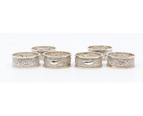 A set of six late Victorian silver floral and scrolled embossed&nbsp;napkin rings, by Henry Wilkinson, London 1898, 137.5 gra