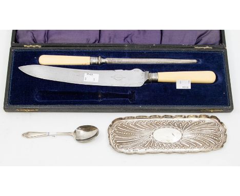 A Victorian silver crumb tray, embossed decoration London 1894 William Comyns, length approx. 20.5cm, along with silver spoon