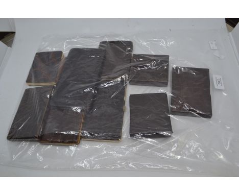 An assembled group of ten various vintage metal mounted crocodile cigarette cases. (10)Condition: generally good with some si