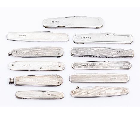 An assembled group of eleven Edwardian and later silver pocket knives, all with engine-turned decoration, gross weight 11.4oz