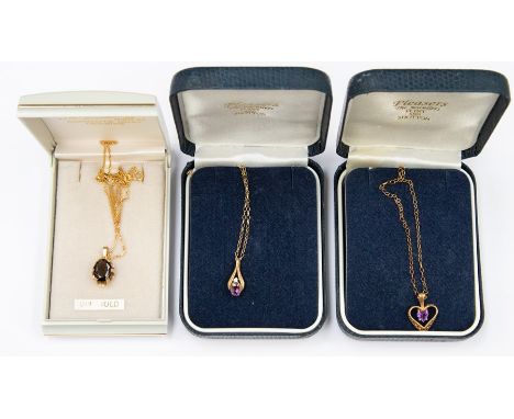 Three 9ct gold pendants to include an amethyst heart pendant, an oval cut smokey quartz pendant and a fancy pendant set with 