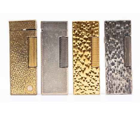 Four Dunhill cigarette lighters, 2nd half 20th Century: two yellow metal with textured finish, one white metal with textured 