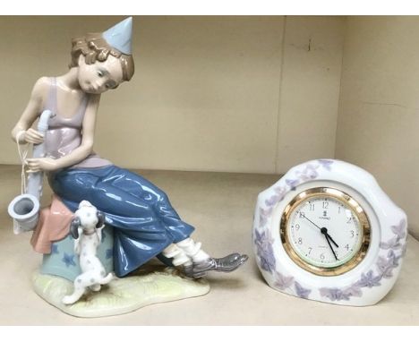 A Lladro figure of a boy with a saxophone and a dog, together with a Lladro mantel clock (quartz movement)