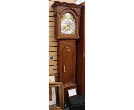 An 18th Century oak eight day longcase clock by George Clapham of Brigg including second and date dial, Roman and Arabic nume