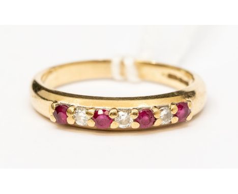 A&nbsp; ruby and diamond set 18ct gold seven stone half eternity ring, set with alternate round cut rubies and brilliant cut 