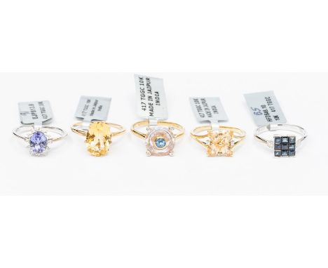 A collection of 9ct gold rings, three yellow gold rings including a Lehrer Torus ring set with pink amethyst, topaz and diamo