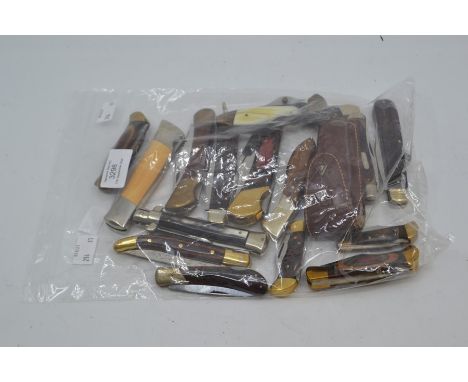 A group of various recent vintage folding lock knives including wood and horn handled examples, blades ranging 1.75" to 4". (
