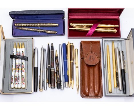 An assembled group of vintage and recent fountain pens, ballpoint pens and retracting pencils, including a Sheaffer boxed set