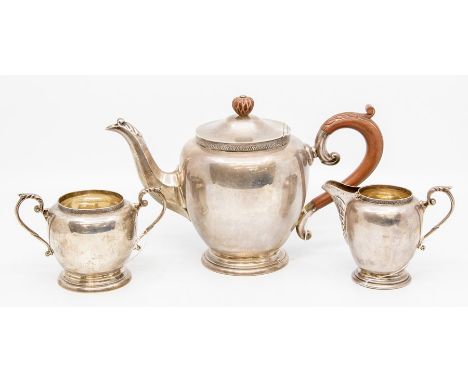 A George V sterling silver three piece tea service, Birmingham, 1930, makers mark for Charles S Green &amp; Co, comprising bu