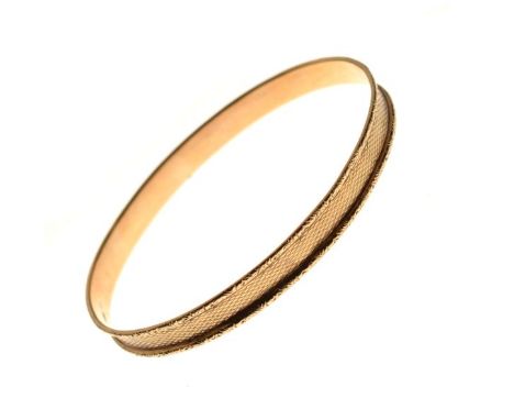 Engine turned 9ct gold bangle, hallmarked for Birmingham 1929, 13.1g approx   Condition: 