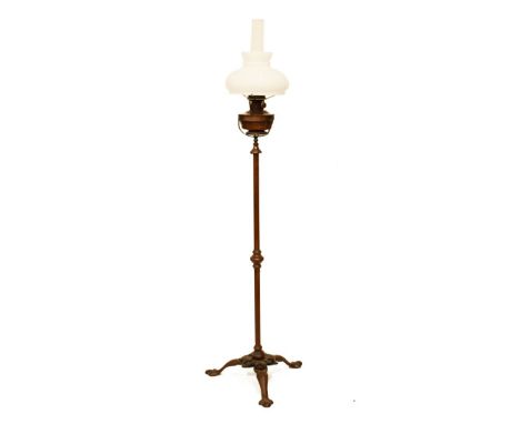 Early 20th Century copper standard lamp having an opaque white glass mushroom shade over copper reservoir and adjustable tubu