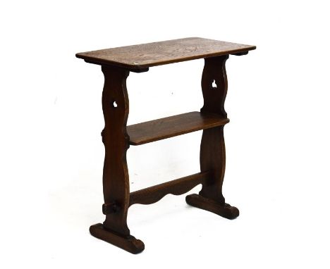 Early 20th Century oak occasional table of ecclesiastical type with oblong top and under shelf between shaped pierced support