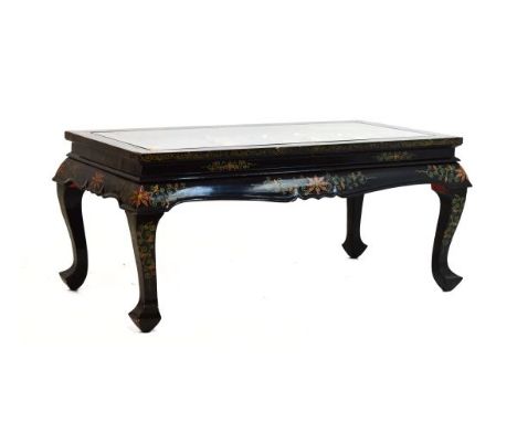 20th Century Oriental black lacquered coffee table, the rectangular top decorated in relief with mother-of-pearl and other sh