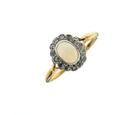 Opal and diamond oval cluster ring, the yellow metal shank stamped 18ct, size N, 2.5g approx gross   Condition: 