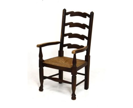 20th Century child's rush seated ash and fruitwood ladder back arm chair   Condition: 