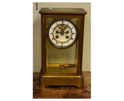 Late 19th/early 20th Century French brass cased four glass mantel clock, the white enamel dial with Roman numerals and visibl