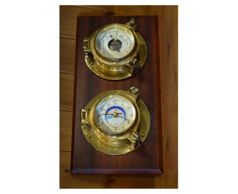 Reproduction ship's bulkhead style combination aneroid barometer and wall clock, each with brass drum housing on mahogany bac