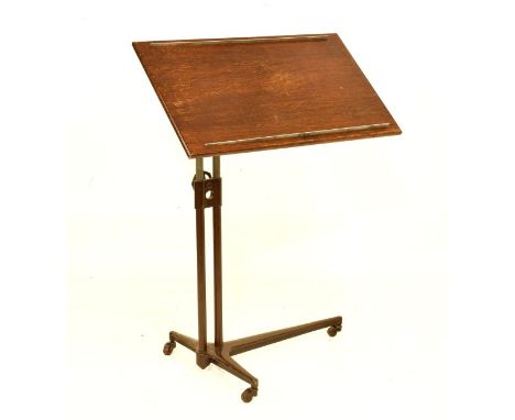Draughtsman's oak easel with inclining rectangular top, on two tubular supports and tripod base with castors   Condition: 