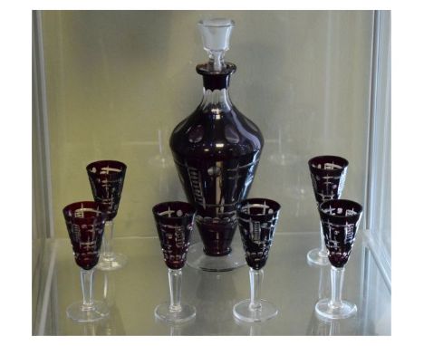 Bohemian ruby flash cut glass liqueur set comprising: baluster shaped decanter and stopper and six glasses   Condition: 